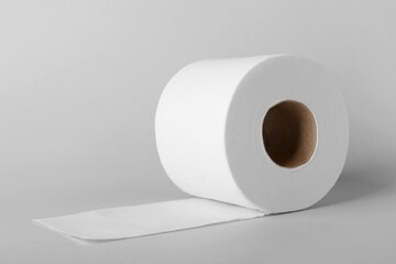 Roll of toilet paper on grey background