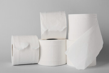 Rolls of toilet paper on grey background