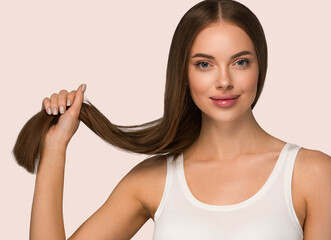 Beautiful woman with long smooth brunette hair clean beautiful skin