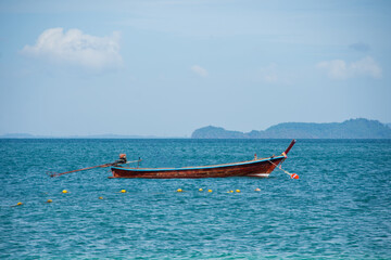beautiful sea summer with boat at Phuket province, Thailand. subject is blurred and noise.