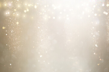 background of abstract gold and silver glitter lights. defocused