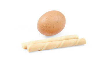 Wafer roll with raw egg isolated on white background