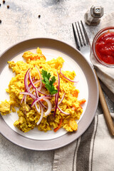 Plate with tasty pilaf on light background
