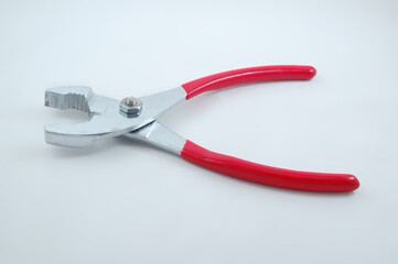 Stainless steel chrome shiny metal pliers tool with red grip