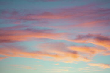 Bright colorful sky at sunset in orange pink purple and blue colors.