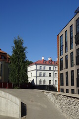 Fototapeta na wymiar Modern new houses, buildings in Kalamaja district. Cloudless sunny day with blue sky. Summertime, July. Tallinn, Estonia, EU