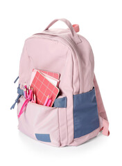 School backpack and stationery on white background