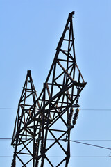 High voltage electric wires against the sky and clouds. Danger. Day.