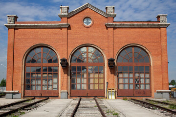 The old locomotive depot. The high gates of the old brick locomotive depot.