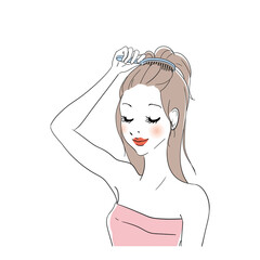 髪をブラッシングする女性