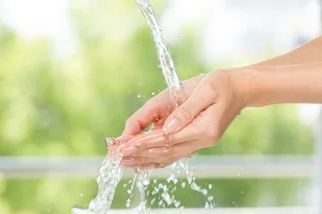 Foto op Plexiglas 水を浴びる女性の手 © kei907