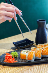Eating roll sushi