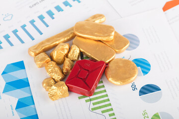 Petrol barrels and gold on documents