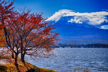 Japanese Travel Destinations. Kawaguchiko Lake in Front of Picturesque Fuji Mountain with Beidge in Background in Japan.
