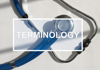 Medical terminology text on stethoscope. Medicine glossary concept - obrazy, fototapety, plakaty
