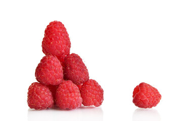 Ripe raspberries lined with a slide and one separate berry isolated on a white background. Element for design. Food clipart