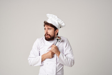 chef cook food in a saucepan in the kitchen cooking work