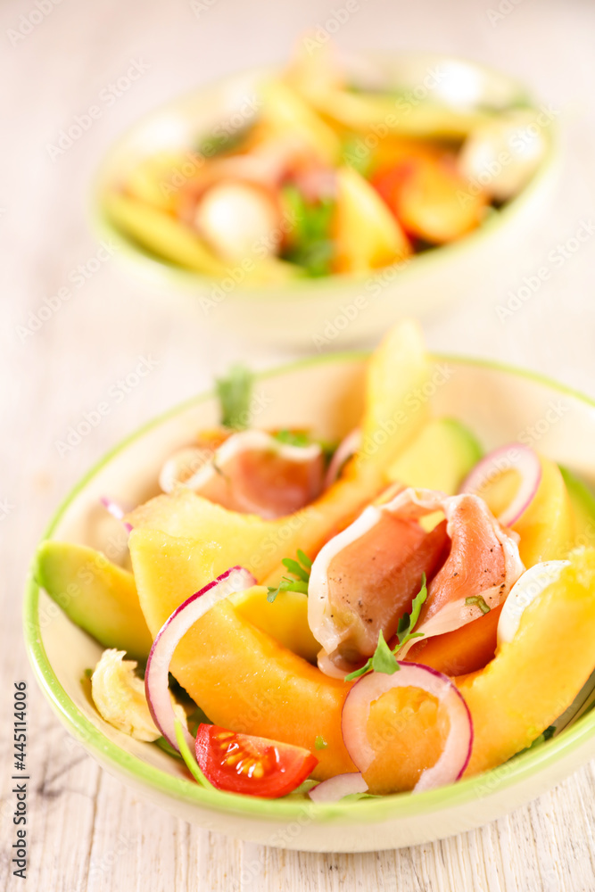 Wall mural melon slices with avocado, mozzarella and ham