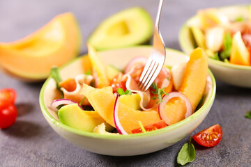 melon salad with avocado,  mozzarella and ham
