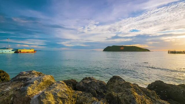 panorama 4k timelapse see the "koh tae nai" tropical island at sunset sky ,rock beach, thongsala pier , koh Phangan ,surrathani ,thailand