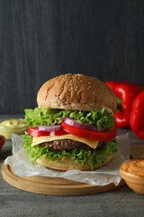 Concept of tasty food with delicious burger