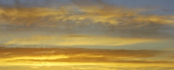 Panoramic sunset with yellow clouds