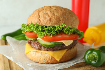 Concept of tasty food with delicious burger