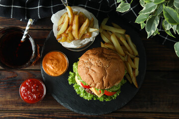 Concept of tasty food with delicious burger
