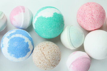 Different bath balls on white background, top view
