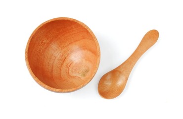 Wooden bowl with wooden spoon isolated on white background
