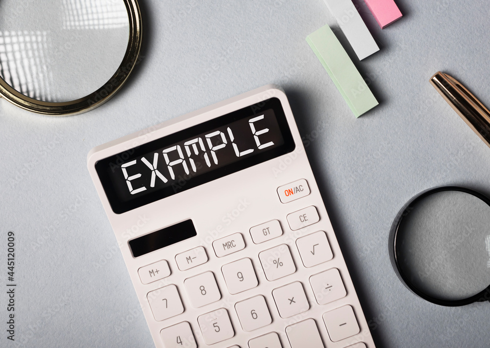 Poster example word on calculator on office desk with stationery, top view