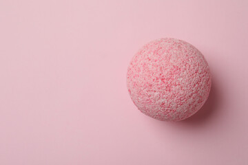Bath ball on pink background, space for text