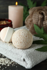 Body care concept with bath balls on wooden table