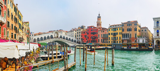 View of the Rialto Bridge of the Grand Canal on a sunny day in Venice, Italy