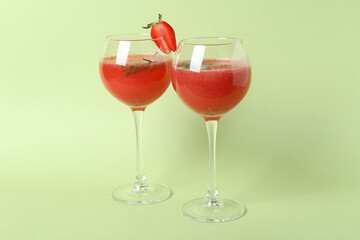Alcoholic Rossini cocktails on light green background