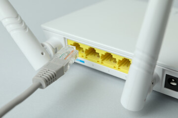 Wi - fi router and connection cable, close up