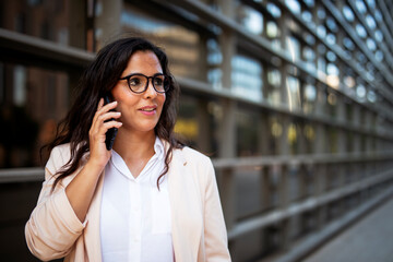Fototapeta premium Young businesswoman on the phone. Female manager on the phone.