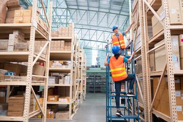 Working at warehouse. A worker checking boxes on the shelf. 