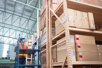 Storehouse employee in uniform working in modern automatic warehouse. Logistics in stock. Warehousing, machinery concept. 
