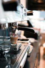 black coffee with milk on coffee maker