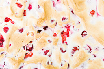 Cherry and strawberry cake on plate and paddle. Top view.