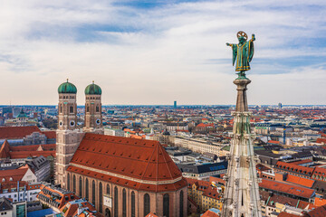 Aerial view of Munich: Muenchner Kindl on top of the New Town Hall and Frauenkirche - obrazy, fototapety, plakaty