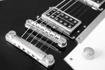 Guitar close up b/w and strings in colour