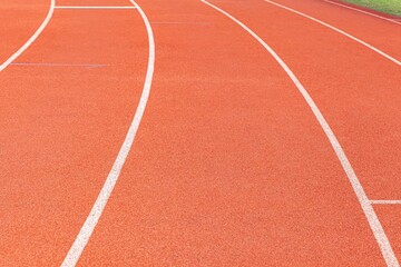 The curved lane in running track or athlete track in stadium. Running track is a rubberized artificial running surface for track and field athletics