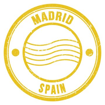 MADRID - SPAIN, words written on yellow postal stamp