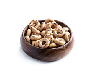 Bowl full of small traditional russian bread rings isolated on white