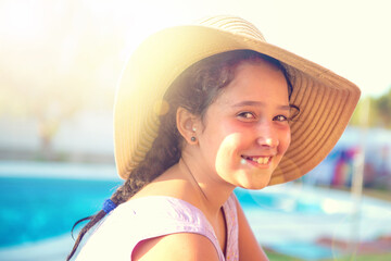 girl with hat at sunset