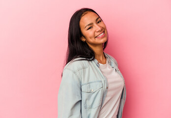 Young Venezuelan woman isolated on pink background confident keeping hands on hips.