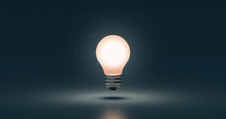 Glowing idea light bulb and innovation thinking creative concept on success inspiration dark...