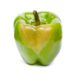 Big rotten green bell pepper isolated